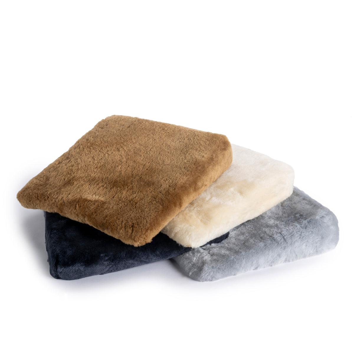 Coussin triangulaire en peau d'agneau, avec rembourrage en mousse