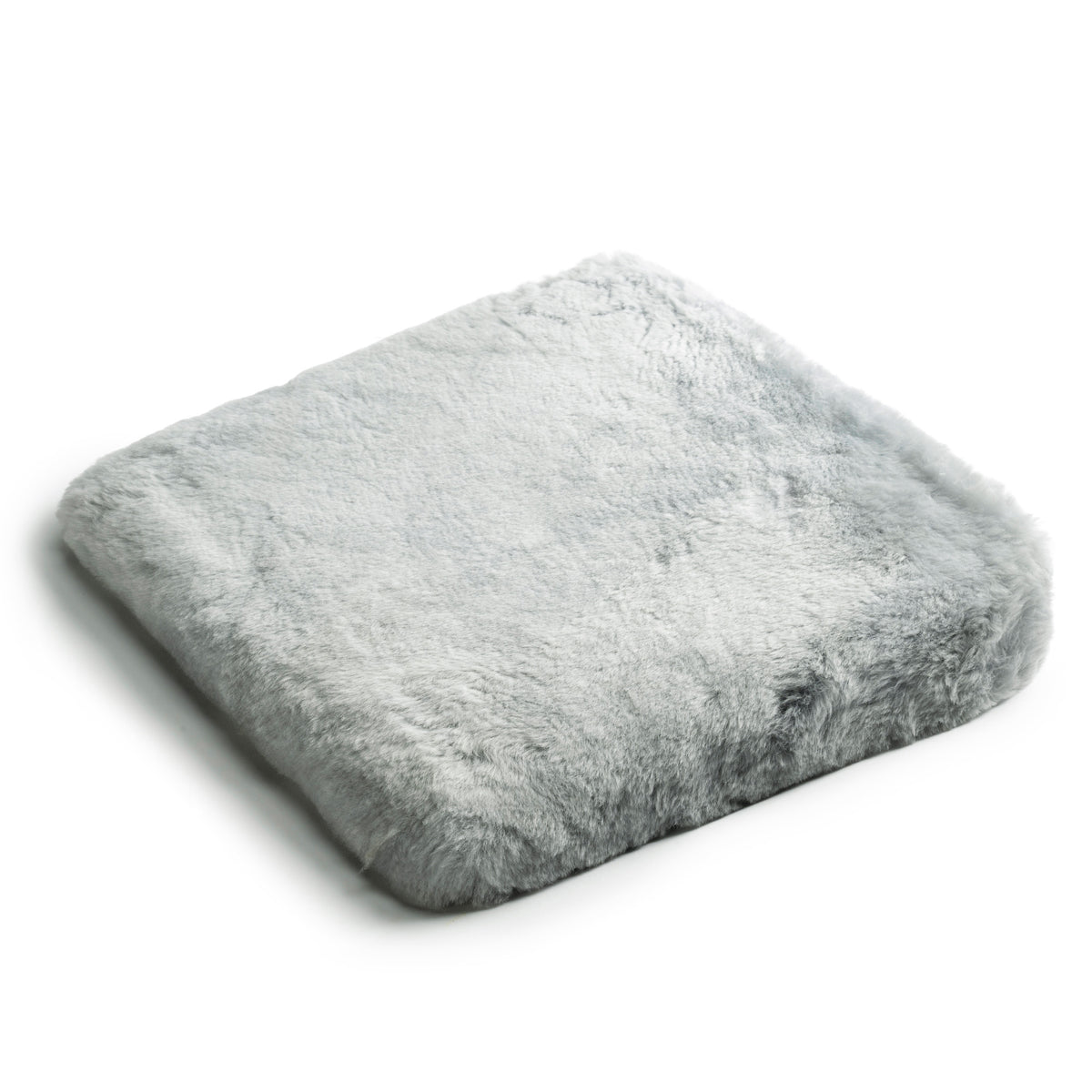 Coussin triangulaire en peau d'agneau, avec rembourrage en mousse
