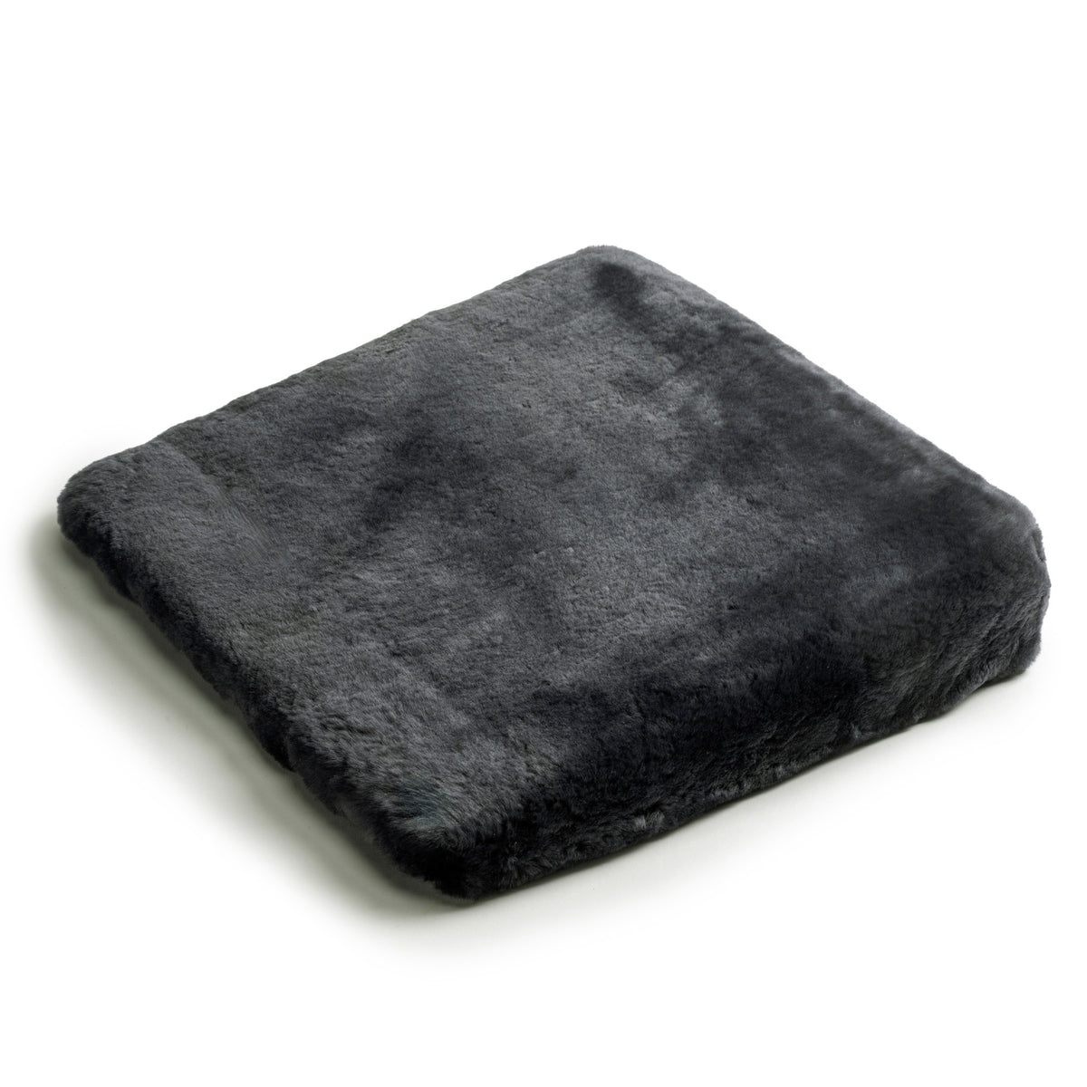 Coussin triangulaire en peau d'agneau, avec rembourrage en mousse